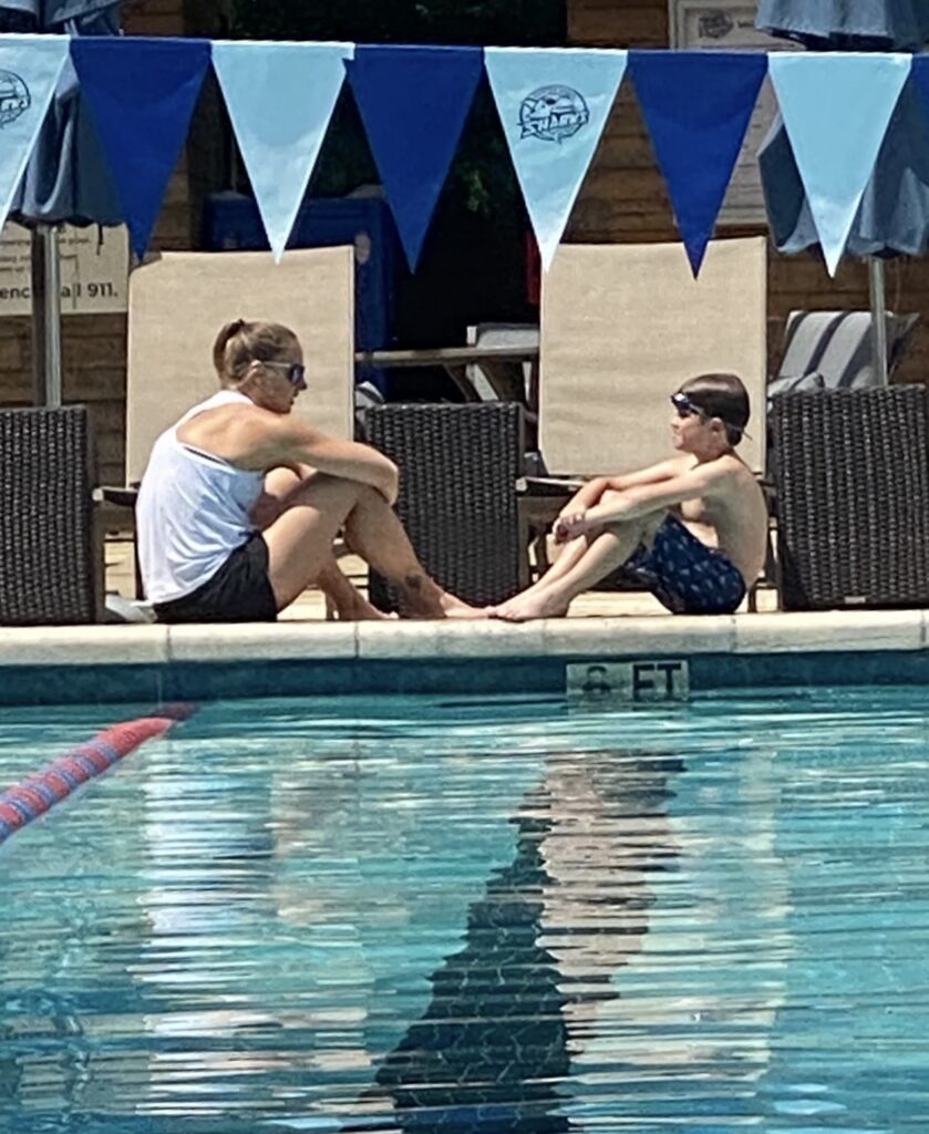 Lina Daugvilate teaches a young student how to swim