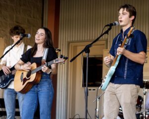 Brody Murchison, Finley Ahern, and Walter Richard performing at the Homecoming Picnic