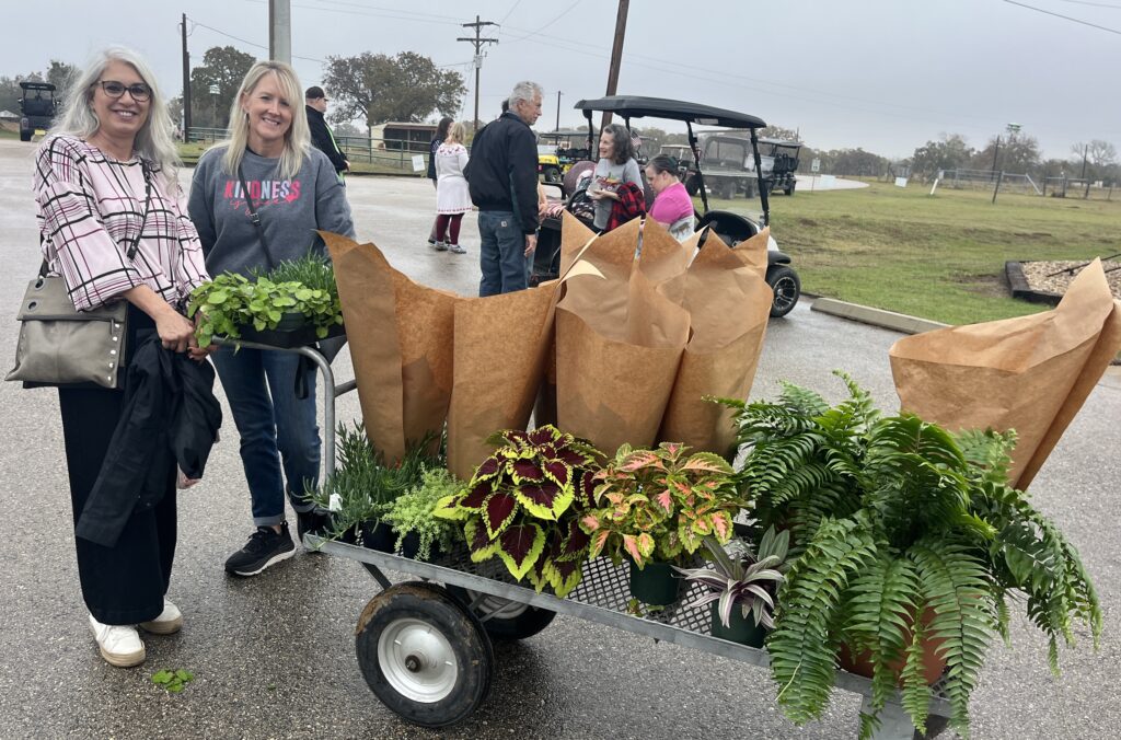 Rebecca Lusk and sister-in-law Kathy Lusk with their purchased plants from DHR nursery