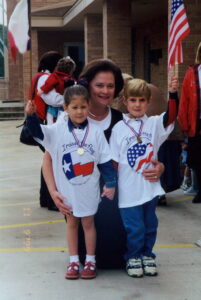 Former teacher and Misty Tate’s mother Carole Mullen, after flag raising in 1999 with former students Cathlyn Jones Davis (now a parent of a CCA student) and Brandon McKee