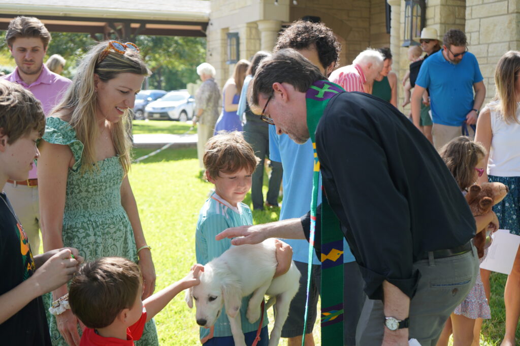 Good Shepherd’s annual Blessing of the Animals, with Stanford blessing Coconut, the Aquilia family dog, and Jen and Eli Aquilia