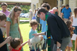 Good Shepherd’s annual Blessing of the Animals, with Stanford blessing Coconut, the Aquilia family dog, and Jen and Eli Aquilia