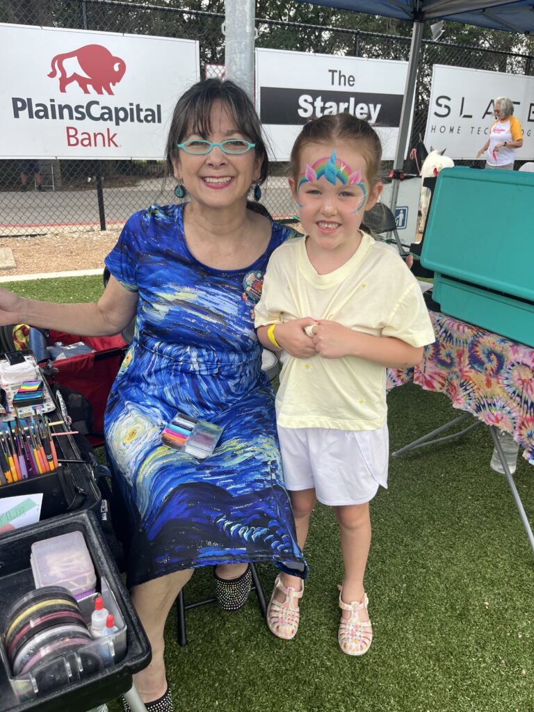 Helen Ingram with Julia at the face painting booth