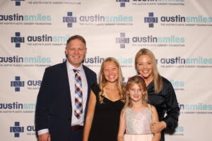 Carroll Kelly with daughters, Viv (left), Liz (right), and wife Josie