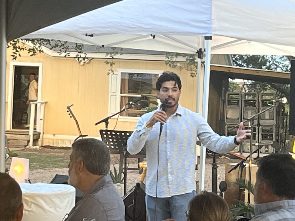 SUM member Jonathan Ortiz speaking to the crowd