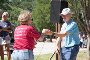 Realtor Carol Dochen and incoming NWACA Board President Sandy Dochen two-stepping to Shotguns Ready