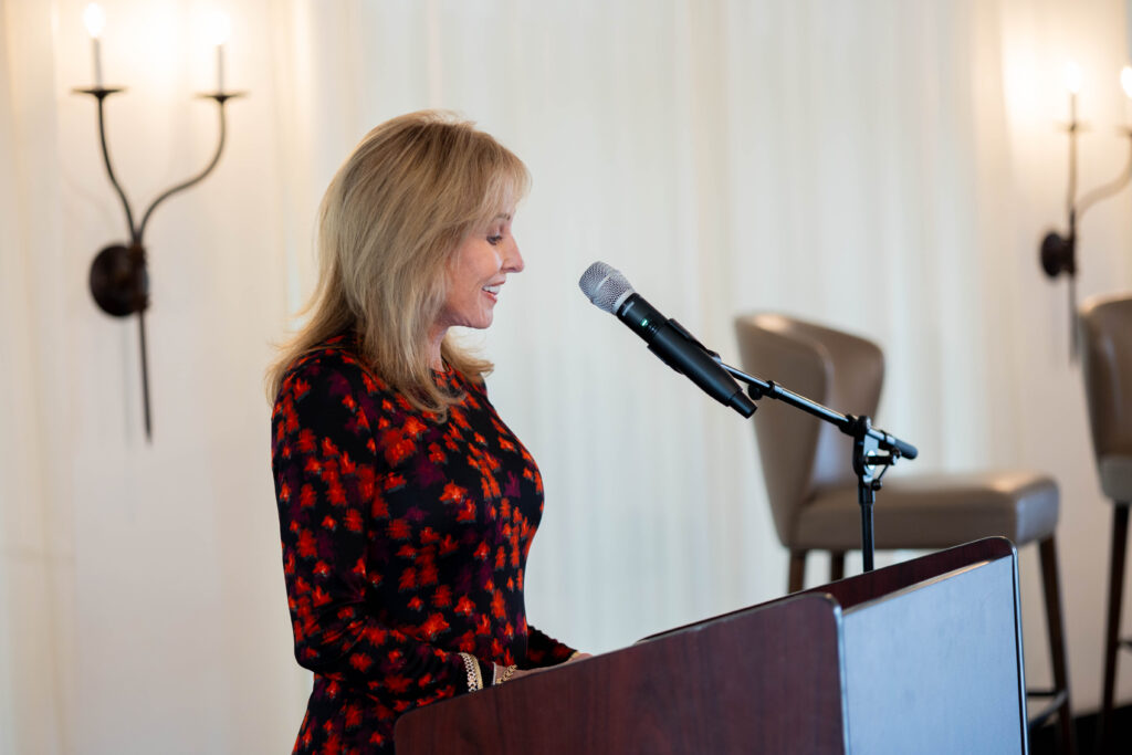 Alzheimer’s Texas board member DK Reynolds speaking at the luncheon