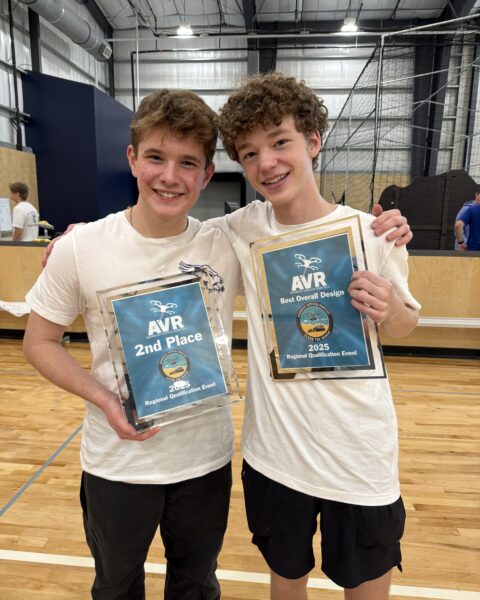 Henry Hubbard and Chris McGlathery holding the team's AVR award plaques