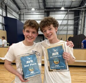 Henry Hubbard and Chris McGlathery holding the team's AVR award plaques