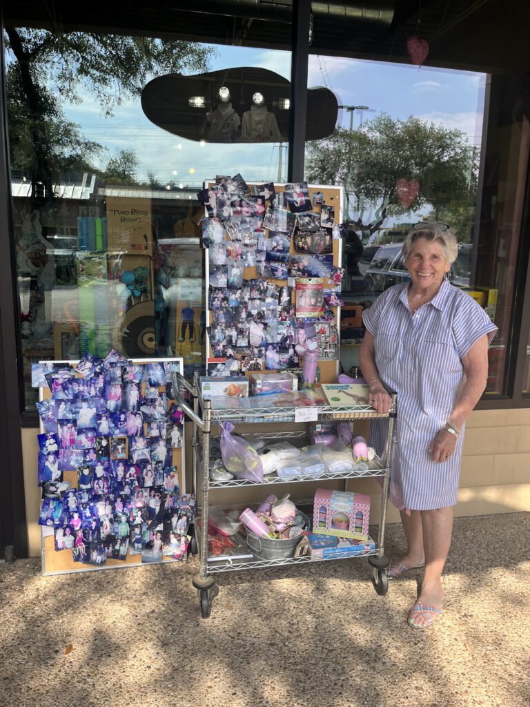 Mary Ann Benson with her memory board at the store. Loyal customers are invited to visit the store to pick up their pictures as a keepsake.