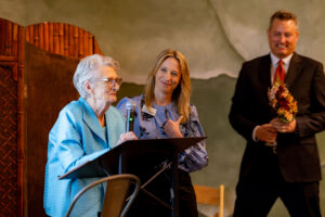 Co-founder Kitty Hoskins, Executive Director Christi Cornell, emcee Bob Ballou