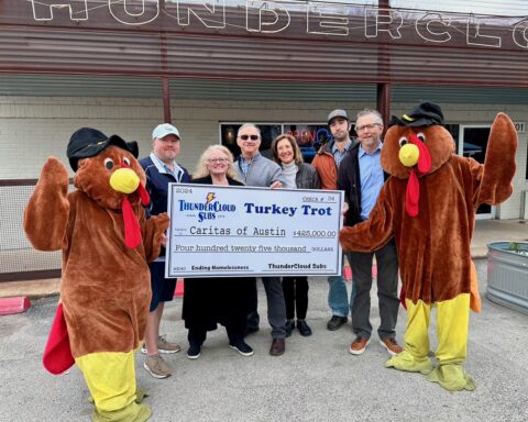 Paul and Patty Sughrue, Mike and Jeannie Haggerty, Ben Haggerty, and David Cohen of ThunderCloud with Trot mascots Andrea Linkenhoger of ThunderCloud and Israel Pena of Caritas