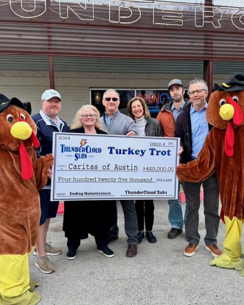 Paul and Patty Sughrue, Mike and Jeannie Haggerty, Ben Haggerty, and David Cohen of ThunderCloud with Trot mascots Andrea Linkenhoger of ThunderCloud and Israel Pena of Caritas